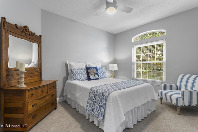 2252 Beach Dr Unit 606, Gulfport, MS 39507 - bedroom featuring light colored carpet, a ceiling fan, and a textured ceiling