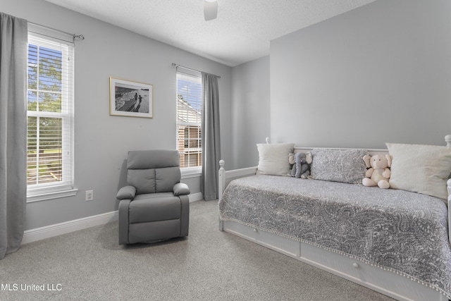 2252 Beach Dr Unit 606, Gulfport, MS 39507 - bedroom featuring carpet, a textured ceiling, and ceiling fan
