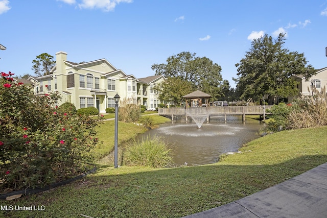 2252 Beach Dr Unit 606, Gulfport, MS 39507 - surrounding community featuring a water view and a yard