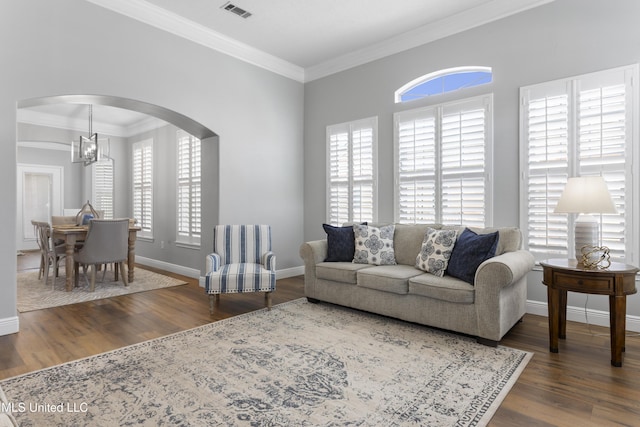 2252 Beach Dr Unit 606, Gulfport, MS 39507 - living room with arched walkways, wood finished floors, crown molding, and a chandelier