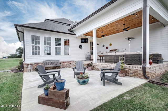 view of patio with outdoor lounge area and ceiling fan