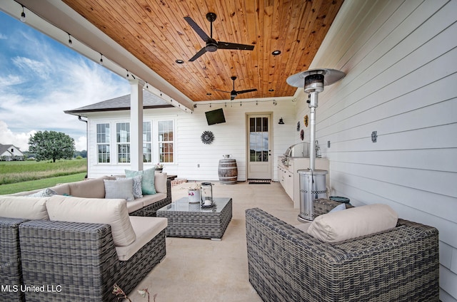 view of patio / terrace featuring ceiling fan and an outdoor living space