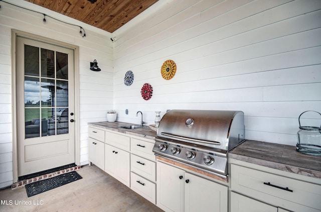 view of patio / terrace with area for grilling and sink