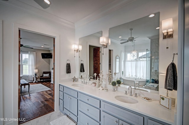 bathroom featuring vanity, ceiling fan, hardwood / wood-style flooring, and ornamental molding