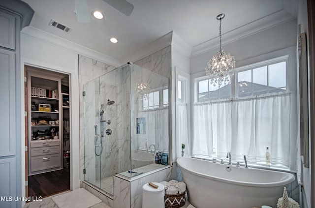 bathroom with crown molding, hardwood / wood-style flooring, independent shower and bath, and ceiling fan with notable chandelier