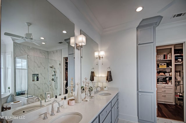 bathroom with vanity, ornamental molding, a shower with shower door, and hardwood / wood-style floors