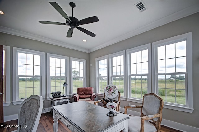 office space featuring ornamental molding, dark hardwood / wood-style floors, and ceiling fan