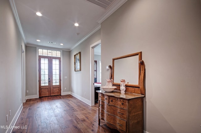 foyer with crown molding, french doors, and wood-type flooring