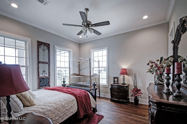 bedroom with ceiling fan, ornamental molding, and dark hardwood / wood-style floors