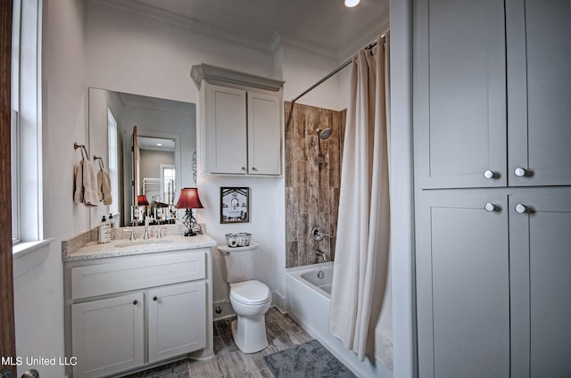 full bathroom featuring toilet, shower / tub combo, wood-type flooring, crown molding, and vanity