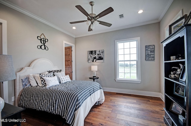 bedroom with ornamental molding, ceiling fan, and dark hardwood / wood-style flooring