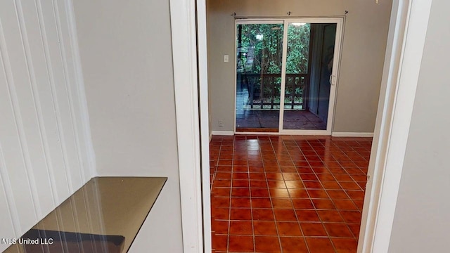 413 Kahler St Unit 27, Gulfport, MS 39507 - hallway with tile patterned flooring and baseboards