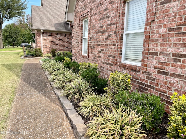 view of property exterior featuring a yard