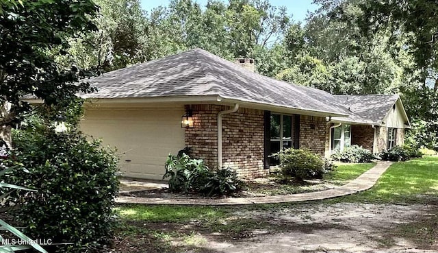 view of side of property featuring a garage