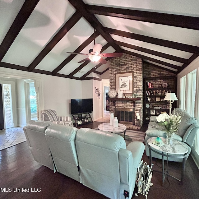 living room featuring vaulted ceiling with beams, dark hardwood / wood-style floors, a fireplace, and ceiling fan