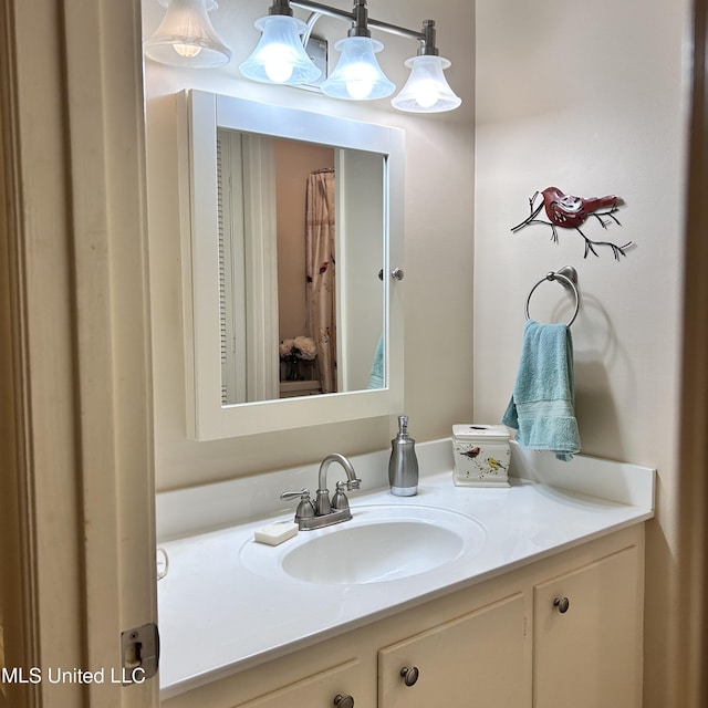 bathroom with vanity and a notable chandelier