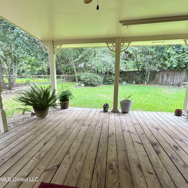 wooden deck with a lawn