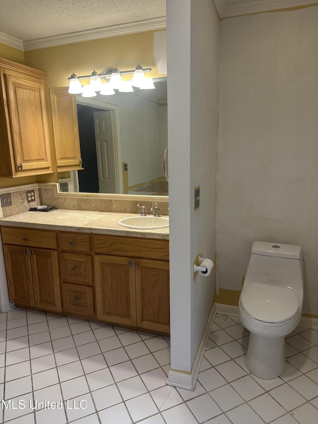 204 Fort Dr, Grenada, MS 38901 - bathroom featuring crown molding, a textured ceiling, vanity, toilet, and tile patterned flooring