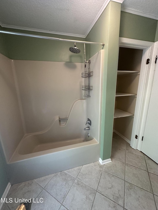 204 Fort Dr, Grenada, MS 38901 - bathroom featuring tile patterned floors, a textured ceiling, shower / tub combination, baseboards, and ornamental molding