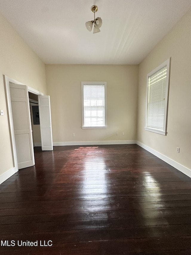 310 N Rankin St, Natchez, MS 39120 - unfurnished bedroom with hardwood / wood-style flooring and baseboards
