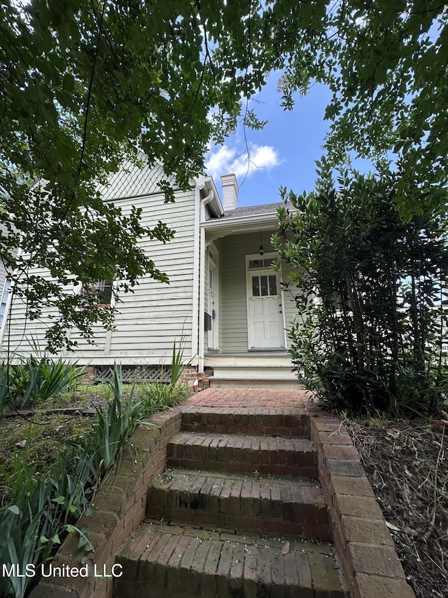 310 N Rankin St, Natchez, MS 39120 - view of exterior entry featuring a chimney