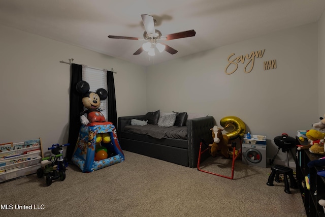 playroom with ceiling fan and carpet flooring