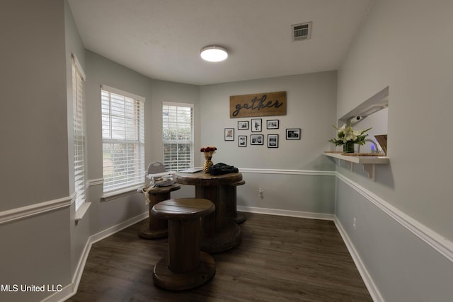 dining space featuring dark hardwood / wood-style floors