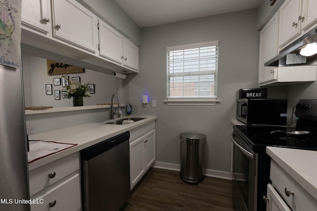 kitchen featuring white cabinetry, sink, dark hardwood / wood-style floors, and appliances with stainless steel finishes