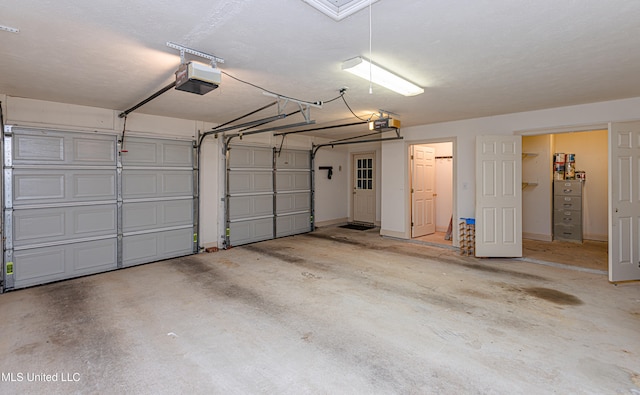 garage featuring a garage door opener