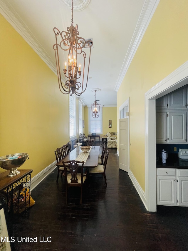 500 Franklin St, Natchez, MS 39120 - dining space featuring a chandelier, ornamental molding, dark wood-style flooring, and baseboards