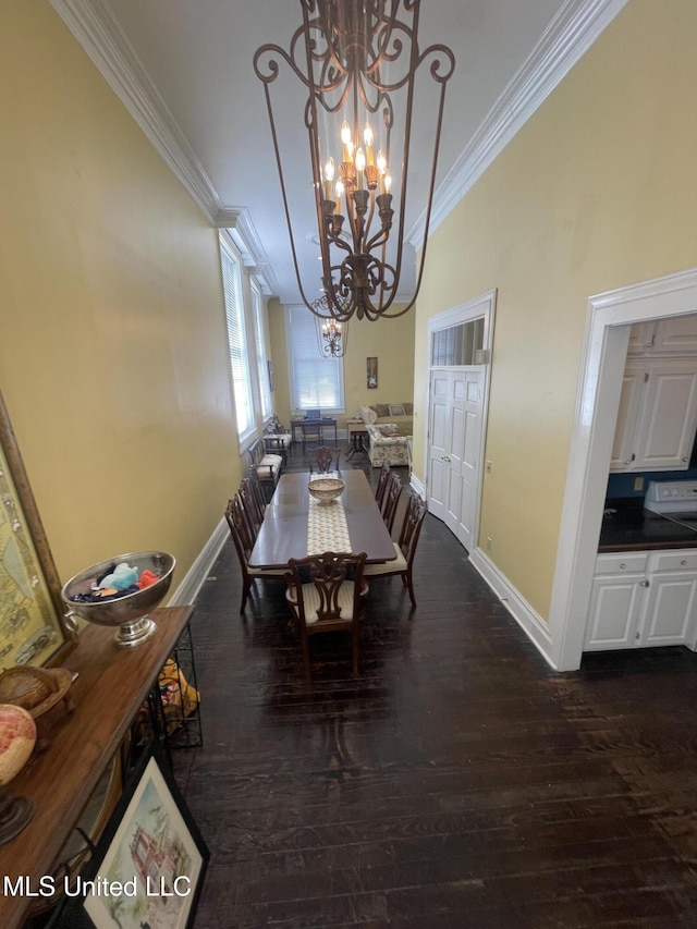 500 Franklin St, Natchez, MS 39120 - dining room featuring ornamental molding, a chandelier, baseboards, and dark wood finished floors