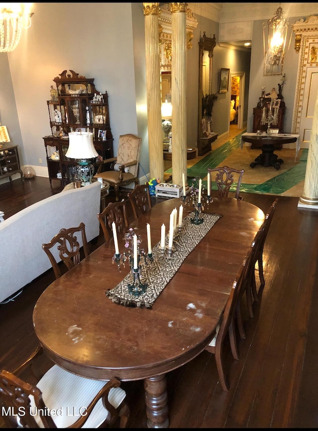 500 Franklin St, Natchez, MS 39120 - dining space featuring hardwood / wood-style flooring, ornate columns, and baseboards