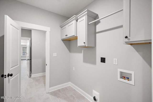 washroom with cabinets, hookup for an electric dryer, and hookup for a washing machine