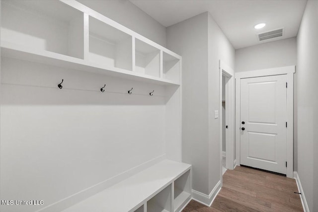 mudroom with hardwood / wood-style floors