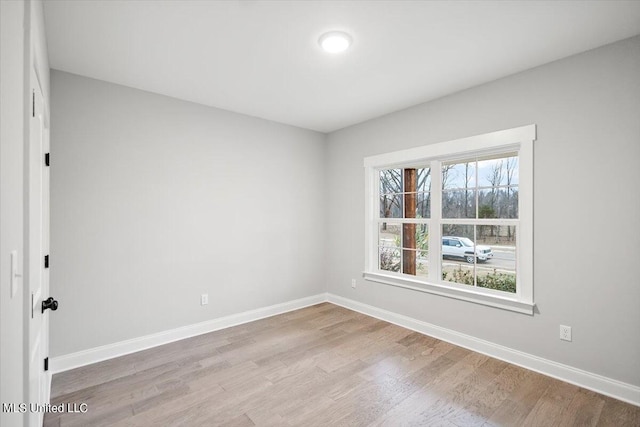 unfurnished room featuring light hardwood / wood-style flooring