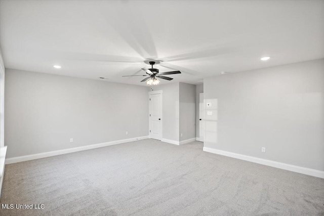 empty room with carpet flooring and ceiling fan