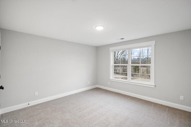 unfurnished room featuring carpet floors