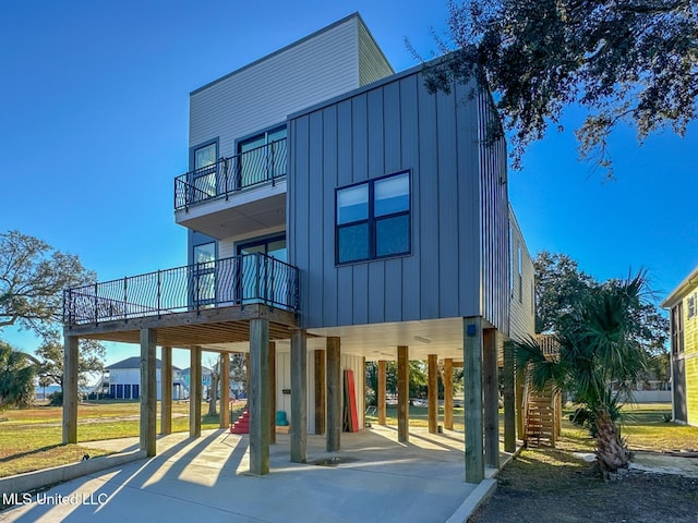 exterior space with a carport and a balcony