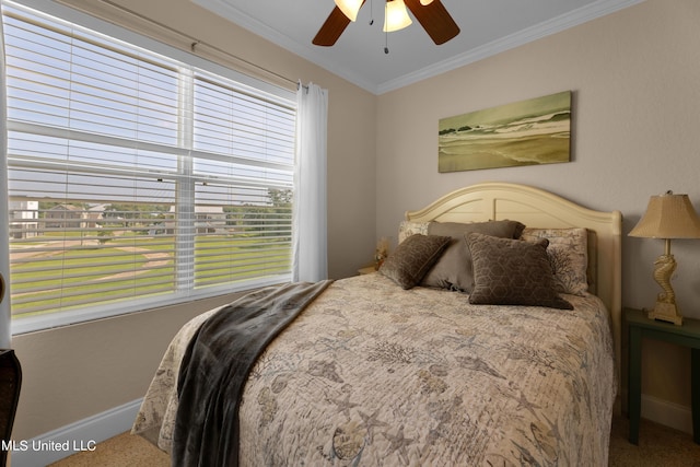 800 W Beach Blvd, Long Beach, MS 39560 - carpeted bedroom featuring baseboards, crown molding, and a ceiling fan