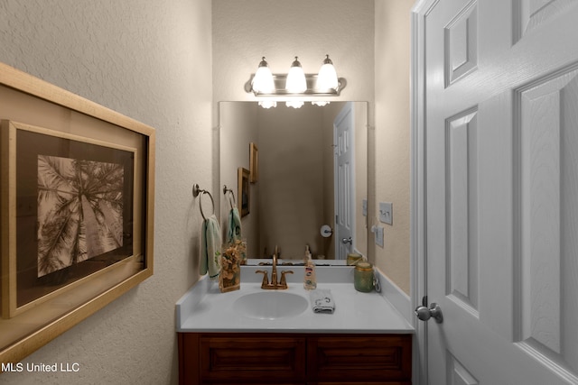 800 W Beach Blvd, Long Beach, MS 39560 - bathroom featuring vanity, a textured wall, and a chandelier