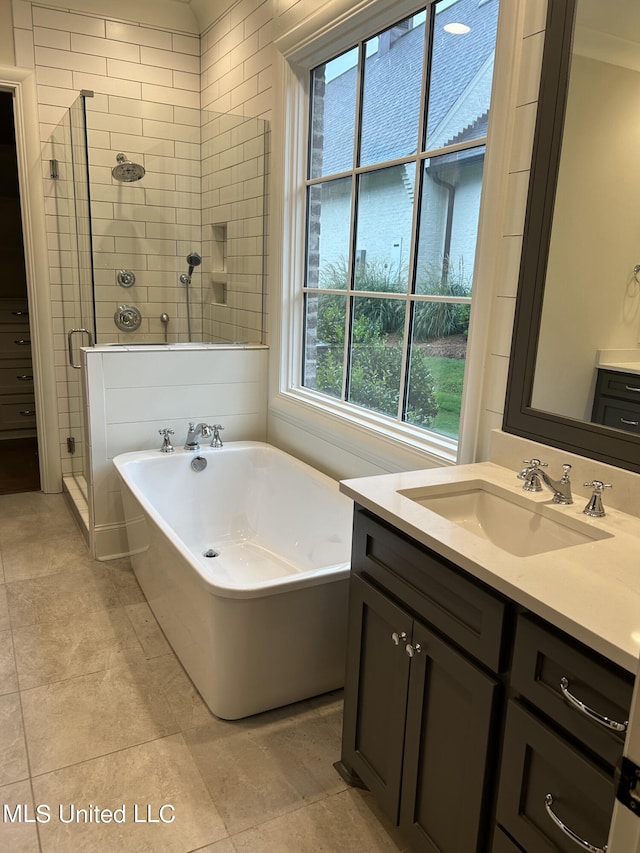 bathroom featuring vanity, tile patterned floors, and independent shower and bath