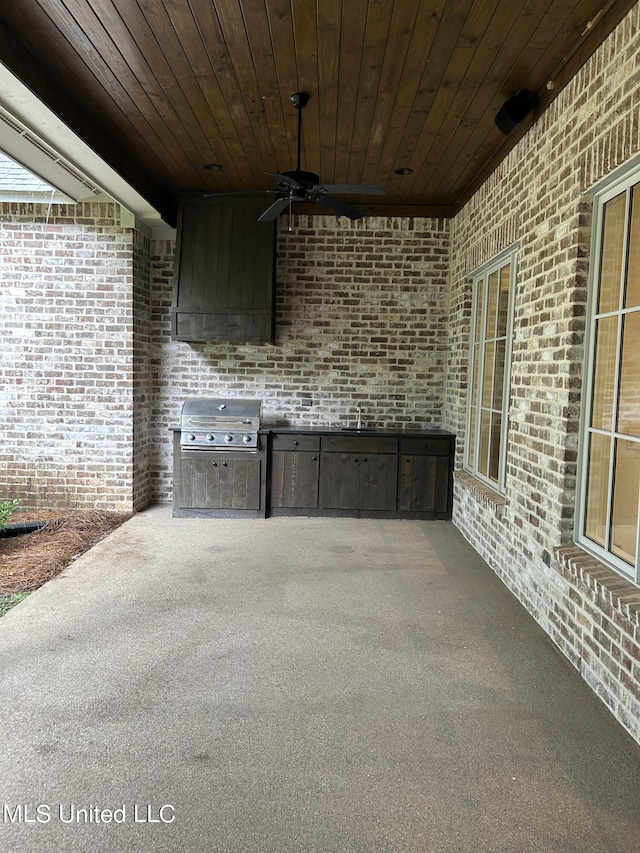 view of patio with sink, a grill, and ceiling fan