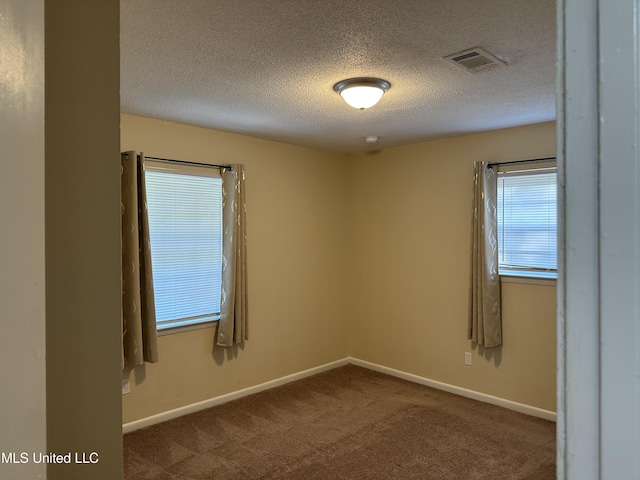 11086 E Taylor Rd, Gulfport, MS 39503 - carpeted spare room with a textured ceiling and baseboards