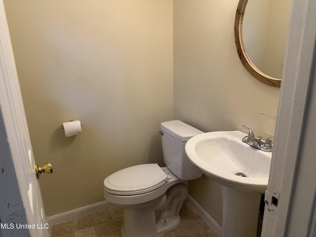 11086 E Taylor Rd, Gulfport, MS 39503 - half bathroom featuring toilet and baseboards