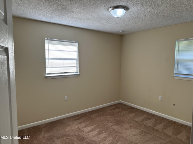 11086 E Taylor Rd, Gulfport, MS 39503 - carpeted spare room featuring a textured ceiling and baseboards