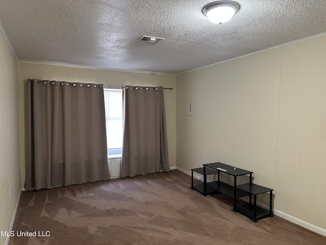11086 E Taylor Rd, Gulfport, MS 39503 - carpeted spare room with a textured ceiling, crown molding, and baseboards