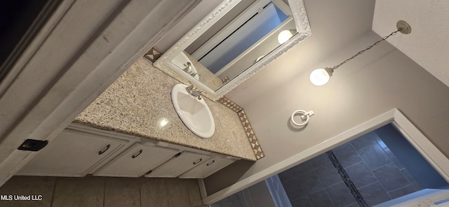 interior details featuring vanity, decorative backsplash, and wood-type flooring