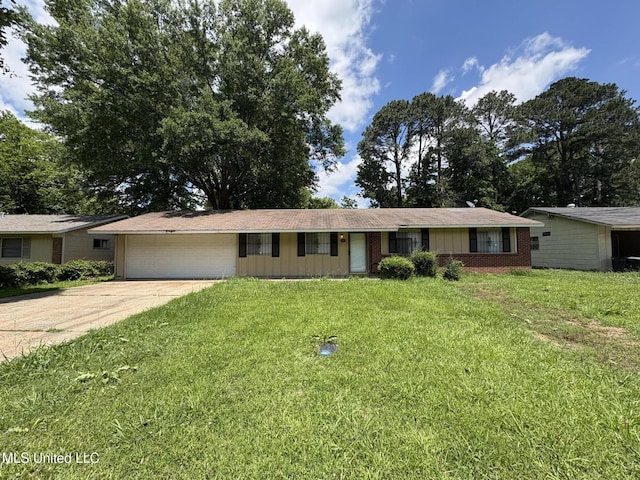 3435 Casa Grande Cir, Jackson, MS 39209 - ranch-style home featuring a garage, concrete driveway, a front lawn, and brick siding
