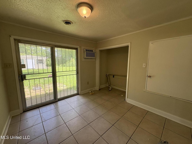 3435 Casa Grande Cir, Jackson, MS 39209 - unfurnished dining area with a textured ceiling, crown molding, light tile patterned floors, baseboards, and a wall unit AC