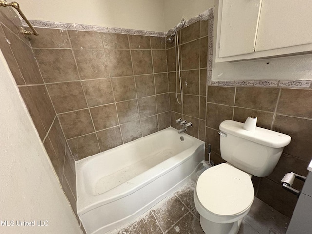 3435 Casa Grande Cir, Jackson, MS 39209 - full bath featuring tile walls, toilet, bathtub / shower combination, and a wainscoted wall